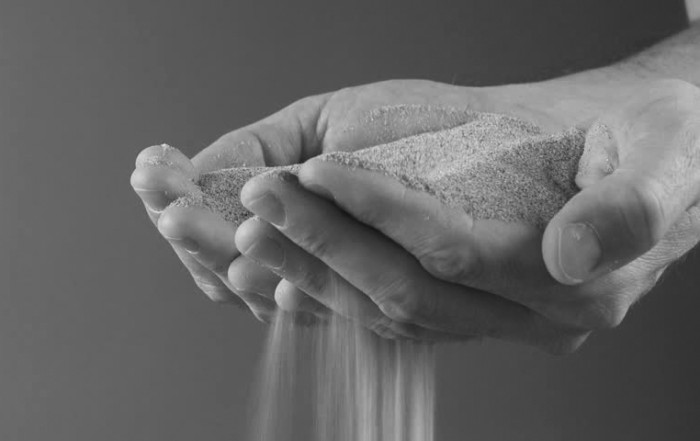 sand through fingers